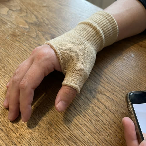 Customer photo of the Sorlelle wrap on hand, palm up, at home