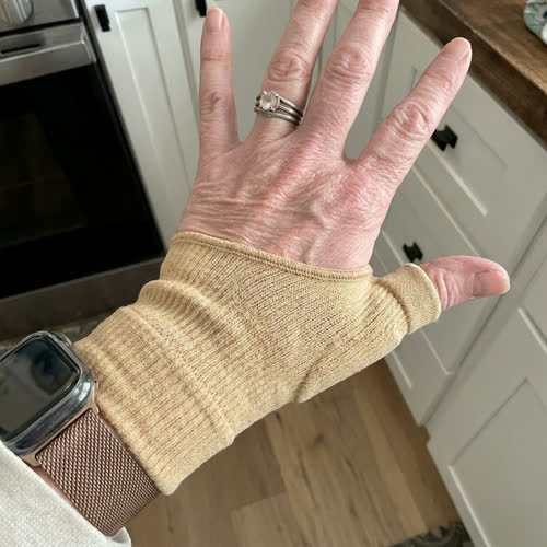 Customer photo of the Sorlelle wrap on arm resting on a table